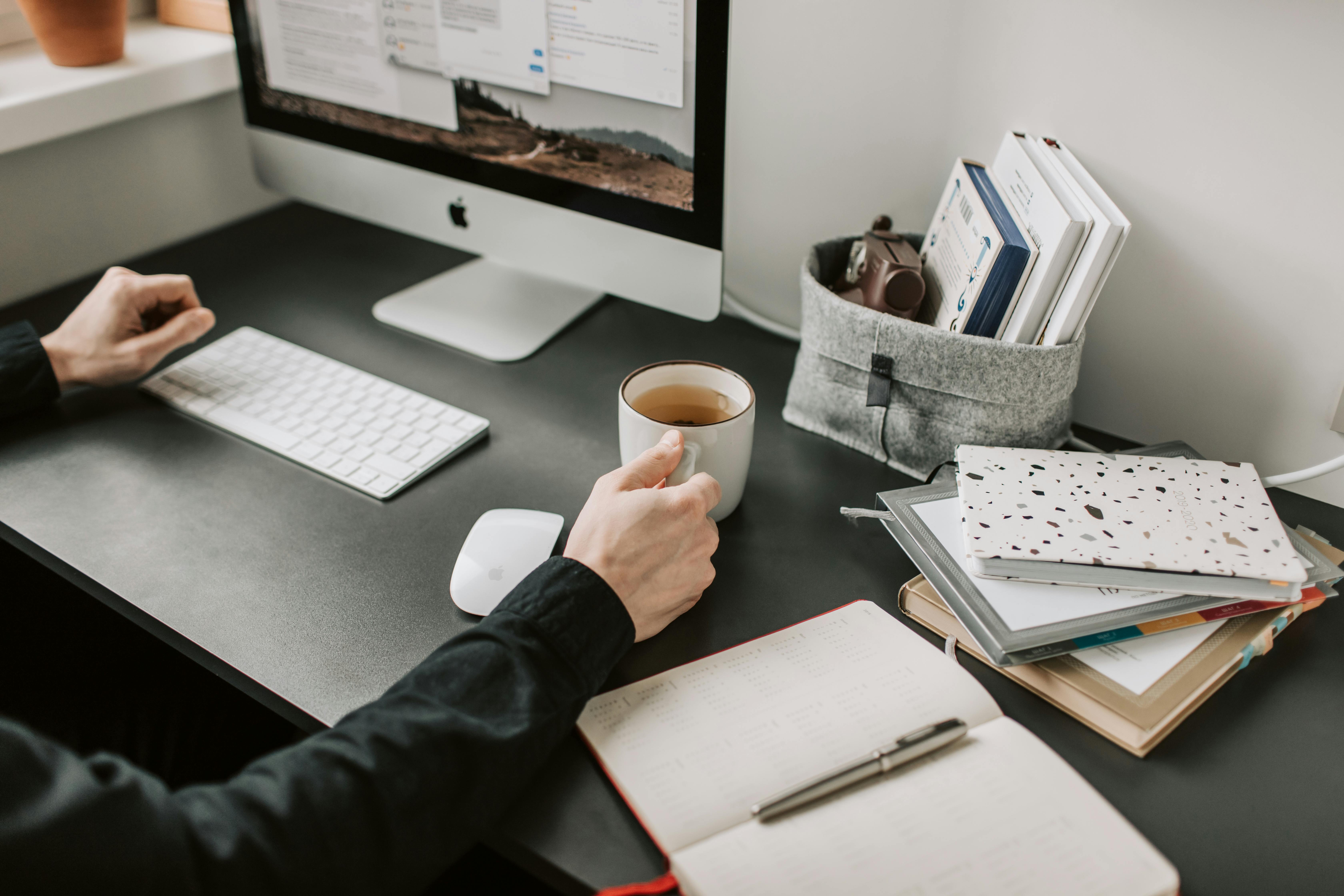 A person managing finances over coffee